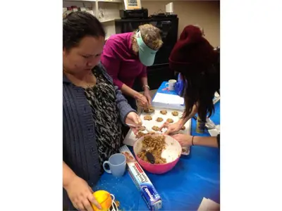 Members making cookies at the office