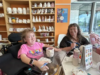 KWA members at Crock A Doodle painting pottery